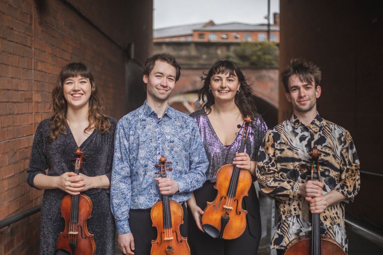 Portrait of the quartet with their instruments.