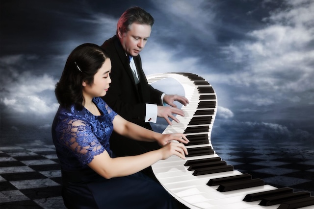 fantasy image of two people playing a keyboard.